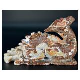 This Red Jasper dragon is a carved symbol of strength, courage, and grounding.