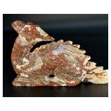 This Red Jasper dragon is a carved symbol of strength, courage, and grounding.