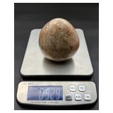 A graceful Peach Moonstone freeform, glowing with soft, warm hues of apricot and cream and flashes in the sunlight.