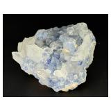 Blue Halite Crystal is a translucent cluster of soft blue cubic formations, exuding a calm, cooling energy.