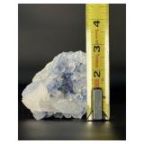Blue Halite Crystal is a translucent cluster of soft blue cubic formations, exuding a calm, cooling energy.