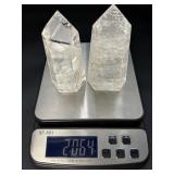 Two mesmerizing Crackle Quartz tower, its interior fractured patterns catching the light likefrozen lightning.