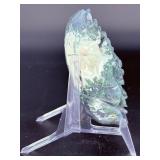 A hand-carved flower crafted from natural moss agate, showcasing intricate petal details and the stone’s unique green and earthy inclusions.