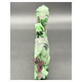 A striking hand-carved dragon sculpted from natural ruby zoisite, showcasing vibrant green and deep red tones.