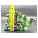 A striking hand-carved dragon sculpted from natural ruby zoisite, showcasing vibrant green and deep red tones.