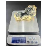 A striking specimen of large blue fluorite perched atop a clear quartz crystal matrix.