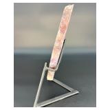 A vibrant Super 7 slice showcasing the unique combination of seven powerful minerals—amethyst, cacoxenite, goethite, lepidocrocite, rutile, smoky quartz, and clear quartz.