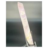 A vibrant Super 7 slice showcasing the unique combination of seven powerful minerals—amethyst, cacoxenite, goethite, lepidocrocite, rutile, smoky quartz, and clear quartz.