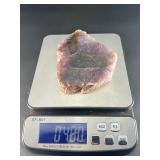 A vibrant Super 7 slice showcasing the unique combination of seven powerful minerals—amethyst, cacoxenite, goethite, lepidocrocite, rutile, smoky quartz, and clear quartz.