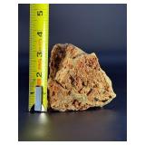 A delicate carbonate mineral of zinc and copper, displaying soft hues of pale blue to green‑blue in fine acicular (needle‑like) crystal sprays or tufted clusters.