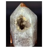 An Agate Druzy Tower is a striking crystal piece that blends the grounding beauty of agate with the sparkling magic of natural druzy formations.