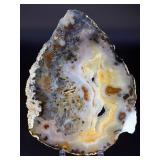 An Agate Slice (Raw) showcases the natural beauty of agate in its most organic form.
