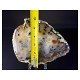An Agate Slice (Raw) showcases the natural beauty of agate in its most organic form.