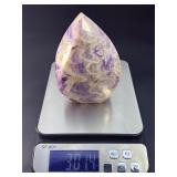 A Chevron Amethyst Freeform is a beautiful, naturally shaped crystal that features striking V-shaped banding of deep purple amethyst and milky white quartz. Also known as Dream Amethyst,