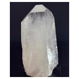 A Brazilian Clear Quartz Point is a powerful and timeless crystal. This naturally formed point features a polished or semi-polished body with a sharp, fully terminated tip, allowing energy to flow smo