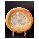 Agate dish is a beautifully polished, hand-carved piece that highlights the natural banding and rich earthy tones of agate.