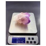 An Elestial Amethyst Cluster is a rare and powerful crystal formation celebrated for its intricate, layered growth and deep spiritual energy.