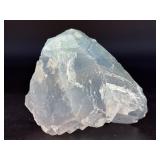 A Blue Raw Fluorite piece showcases the crystal in its natural, unpolished state, highlighting its geometric formations and soft to vibrant blue hues.