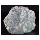 A Blue Raw Fluorite piece showcases the crystal in its natural, unpolished state, highlighting its geometric formations and soft to vibrant blue hues.