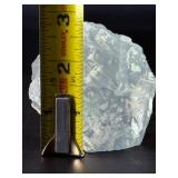 A Blue Raw Fluorite piece showcases the crystal in its natural, unpolished state, highlighting its geometric formations and soft to vibrant blue hues.