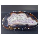 Banded Amethyst Agate (Polished) is a stunning crystal piece that combines the deep, rich purples of amethyst with the layered, earthy tones of agate.