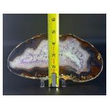 Banded Amethyst Agate (Polished) is a stunning crystal piece that combines the deep, rich purples of amethyst with the layered, earthy tones of agate.