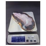 Banded Amethyst Agate (Polished) is a stunning crystal piece that combines the deep, rich purples of amethyst with the layered, earthy tones of agate.