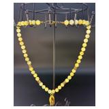 This is a beautifully crafted piece that blends the warm, golden tones of honey calcite with symbolic spiritual energy. The Gyan Mudra hand charm representing wisdom and spiritual connection.