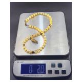 This is a beautifully crafted piece that blends the warm, golden tones of honey calcite with symbolic spiritual energy. The Gyan Mudra hand charm representing wisdom and spiritual connection.