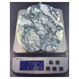 Large Hand-Carved Moss Agate Leaf is a beautifully sculpted piece that showcases the natural beauty of moss agate in a graceful, leaf-shaped form.