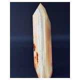 Carnelian Flower Agate Tower is a stunning hand-carved crystal that combines the vibrant, energizing hues of carnelian with the earthy, patterned beauty of flower agate.