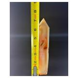 Carnelian Flower Agate Tower is a stunning hand-carved crystal that combines the vibrant, energizing hues of carnelian with the earthy, patterned beauty of flower agate.