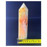 Carnelian Flower Agate Tower is a stunning hand-carved crystal that combines the vibrant, energizing hues of carnelian with the earthy, patterned beauty of flower agate.
