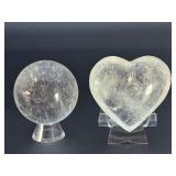 Quartz Sphere and Quartz Heart with Inclusions are captivating crystal pieces that showcase the natural beauty and energetic depth of quartz.