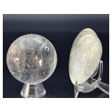 Quartz Sphere and Quartz Heart with Inclusions are captivating crystal pieces that showcase the natural beauty and energetic depth of quartz.