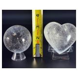 Quartz Sphere and Quartz Heart with Inclusions are captivating crystal pieces that showcase the natural beauty and energetic depth of quartz.