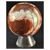 Laguna Lace Agate Sphere is a mesmerizing crystal sphere that highlights the intricate, lace-like banding unique to Laguna Agate.