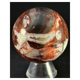 Laguna Lace Agate Sphere is a mesmerizing crystal sphere that highlights the intricate, lace-like banding unique to Laguna Agate.