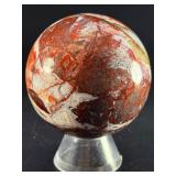 Laguna Lace Agate Sphere is a mesmerizing crystal sphere that highlights the intricate, lace-like banding unique to Laguna Agate.