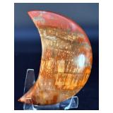 Petrified Wood Moon is a beautifully carved piece that captures ancient earth energy in a graceful moon shape.