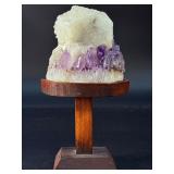 Amethyst Geode with Calcite is a stunning natural formation that combines sparkling amethyst crystals with contrasting calcite inclusions.