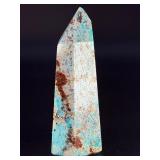 Amazonite Tower is a beautifully polished crystal tower that showcases the soothing, turquoise-green hues of amazonite, often accented with natural striations and subtle white veining.