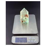 Amazonite Tower is a beautifully polished crystal tower that showcases the soothing, turquoise-green hues of amazonite, often accented with natural striations and subtle white veining.