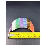 Moon-Shaped Crystal with Red Jasper, Tiger Eye, Sodalite, Charoite, Aventurine, Howlite & Amethyst is a vibrant, multi-stone piece carved into a graceful crescent moon.