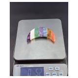 Moon-Shaped Crystal with Red Jasper, Tiger Eye, Sodalite, Charoite, Aventurine, Howlite & Amethyst is a vibrant, multi-stone piece carved into a graceful crescent moon.