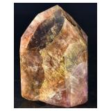 Super 7 Tower is a powerful and highly sought-after crystal carved into a polished towerthat showcases the natural blend of seven minerals: amethyst, clear quartz, smokyquartz, rutile, goethite, lepid