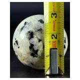 Rainbow Moonstone Sphere is a luminous and enchanting crystal sphere known for its soft glow and mesmerizing flashes of blue, rainbow, and pearly light that shimmer as it moves.