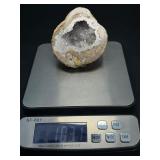 Natural Quartz Agate “Galaxy” Geode is a mesmerizing geological treasure that resembles a miniature cosmic landscape.