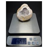 Natural Quartz Agate “Galaxy” Geode is a mesmerizing geological treasure that resembles a miniature cosmic landscape.