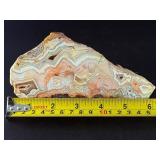 Laguna Lace Agate (Partial Polished) is a striking natural piece that beautifully balances raw texture with smooth, polished detail.